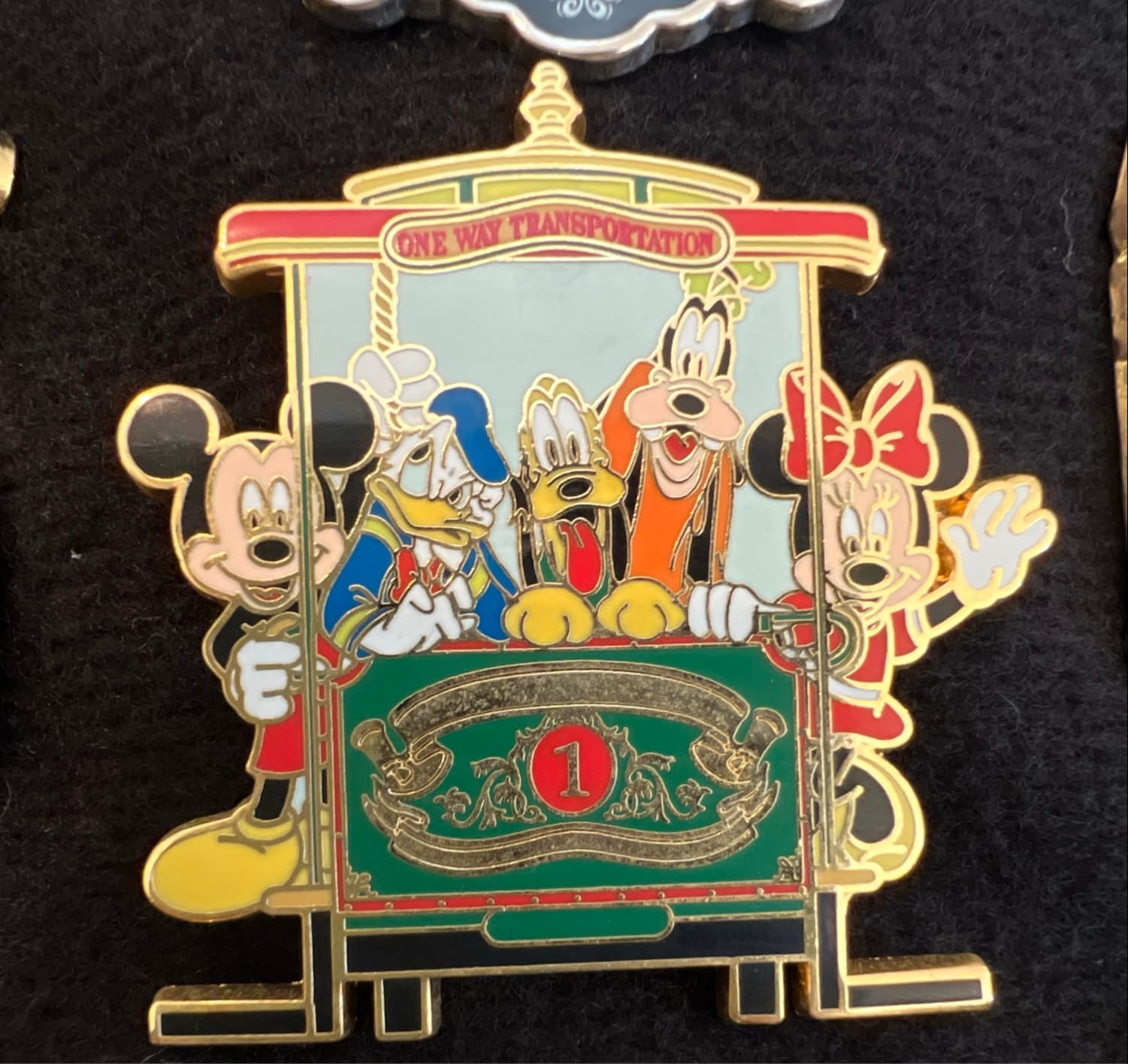 Mickey, Minnie, Donald, Pluto and Goofy one way transportation trolley