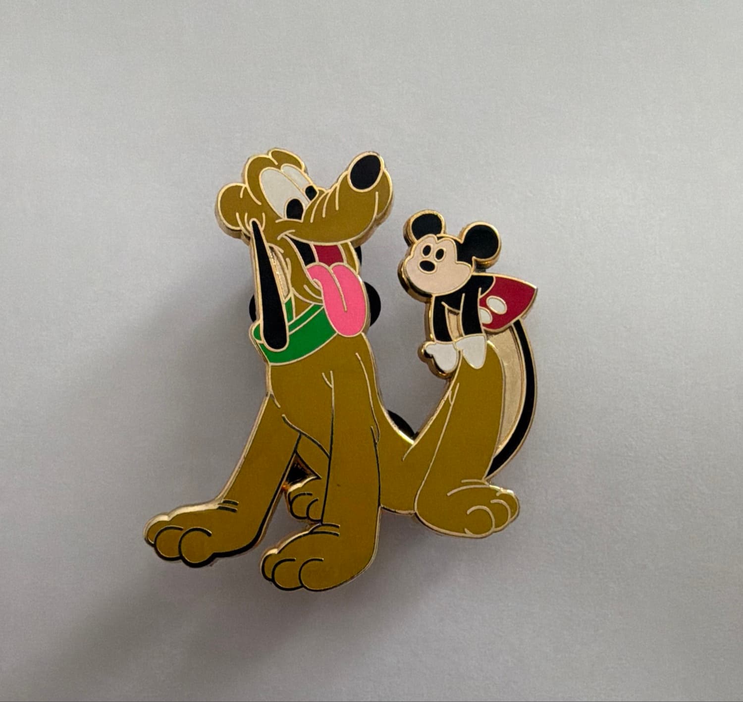 Mickey riding Pluto rocking horse