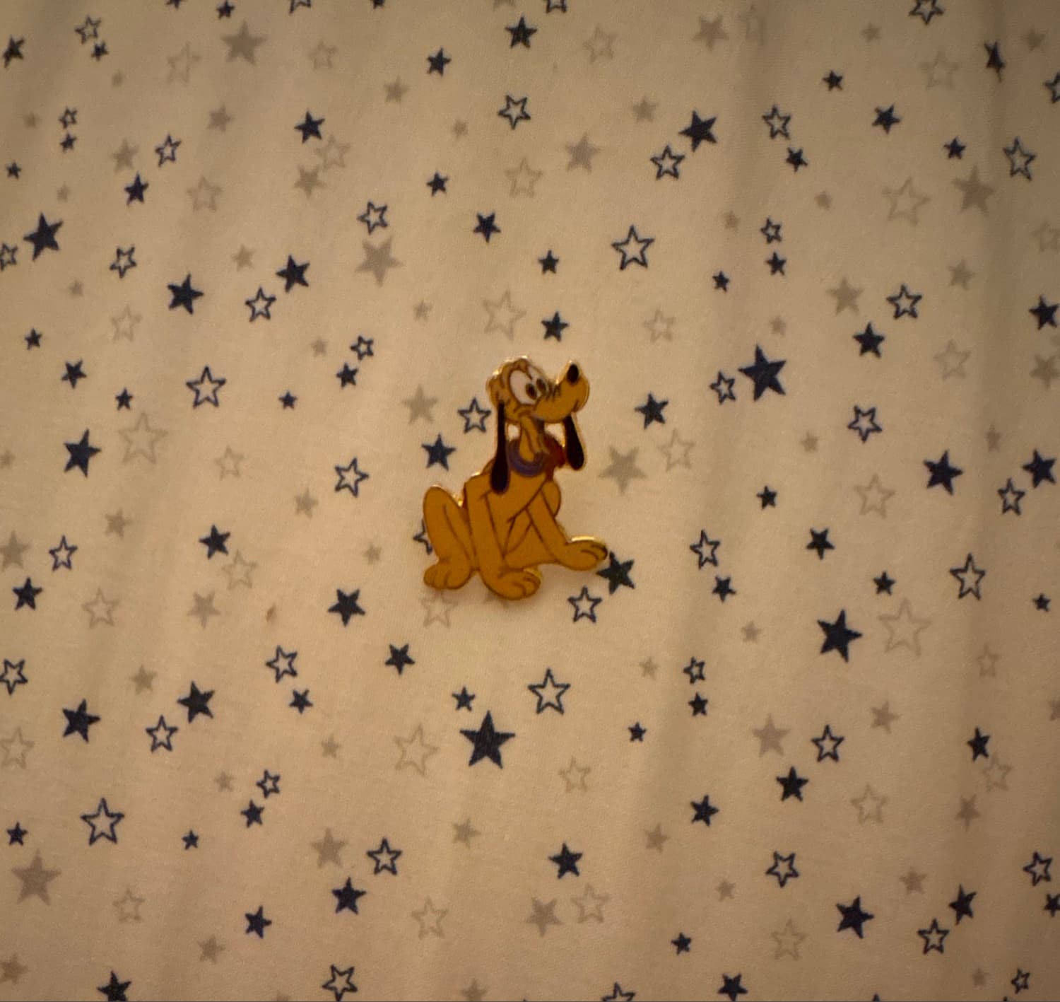 Pluto Sitting with Tongue Out and Purple Collar