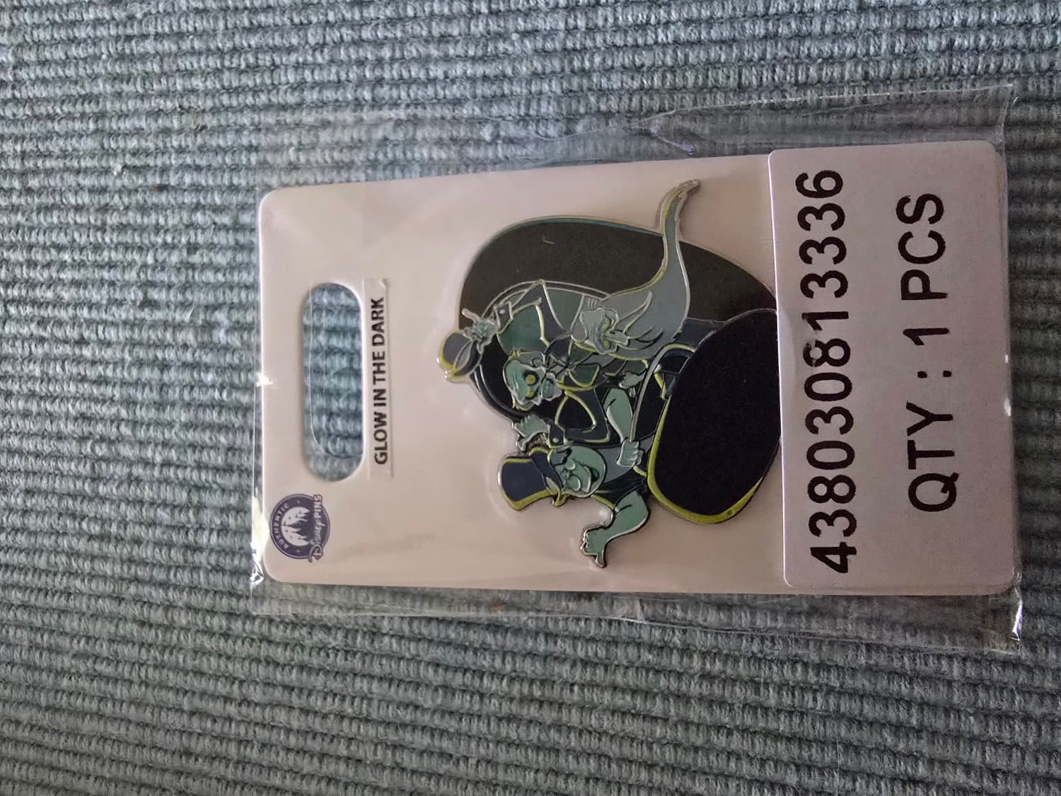 Hitchhiking Ghosts Glow-in-the-Dark Pin – The Haunted Mansion front