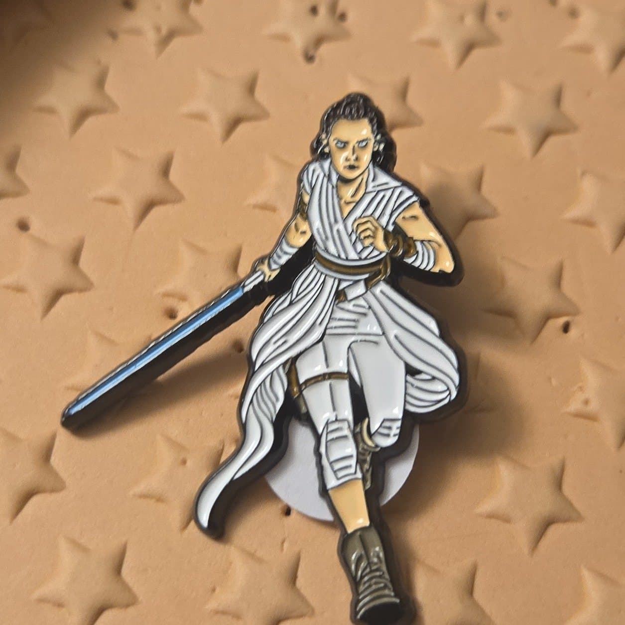 Rey Skywalker Resist Pin with Blue Lightsaber