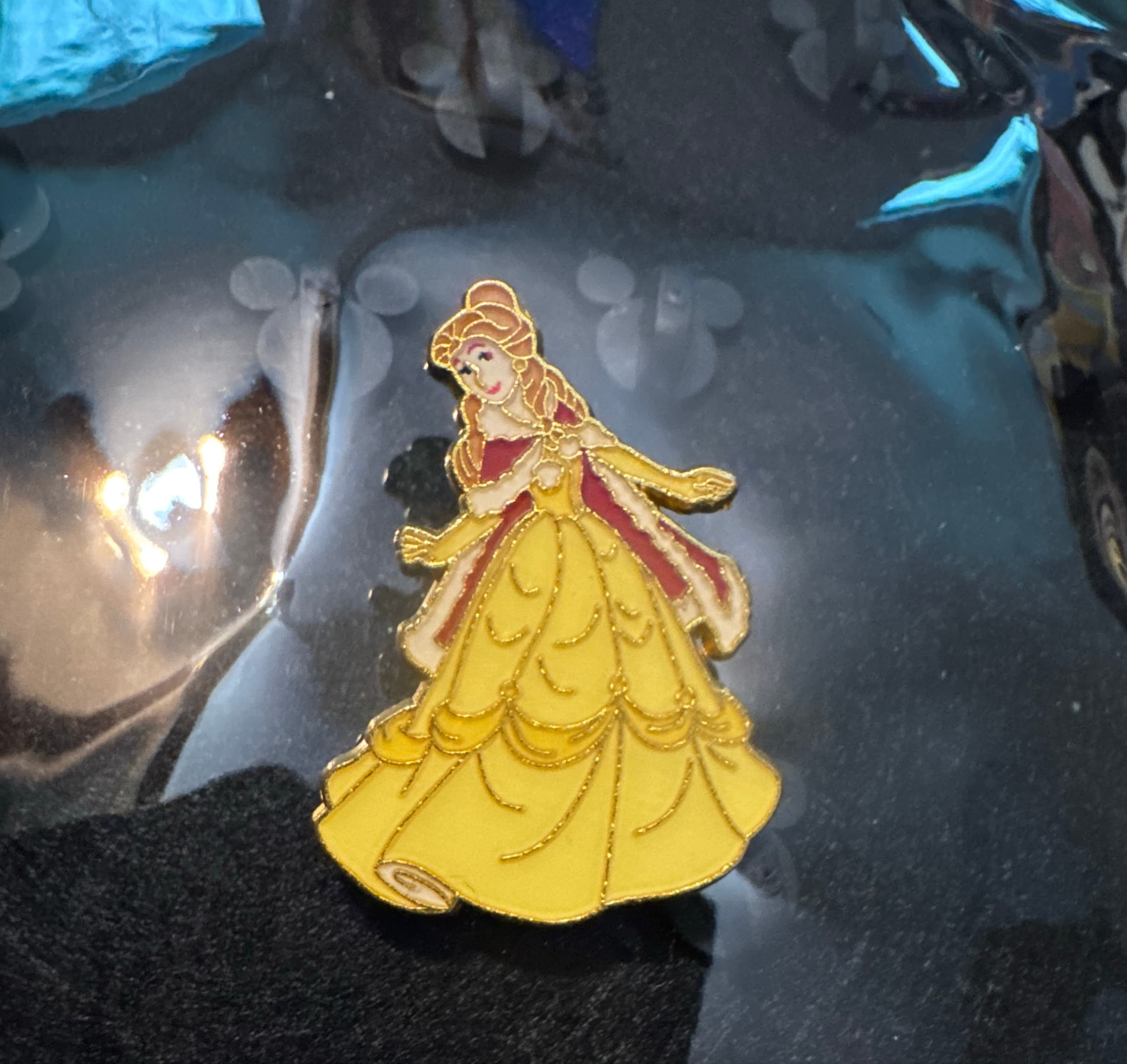 Belle Standing in Yellow Gown with Red Trim