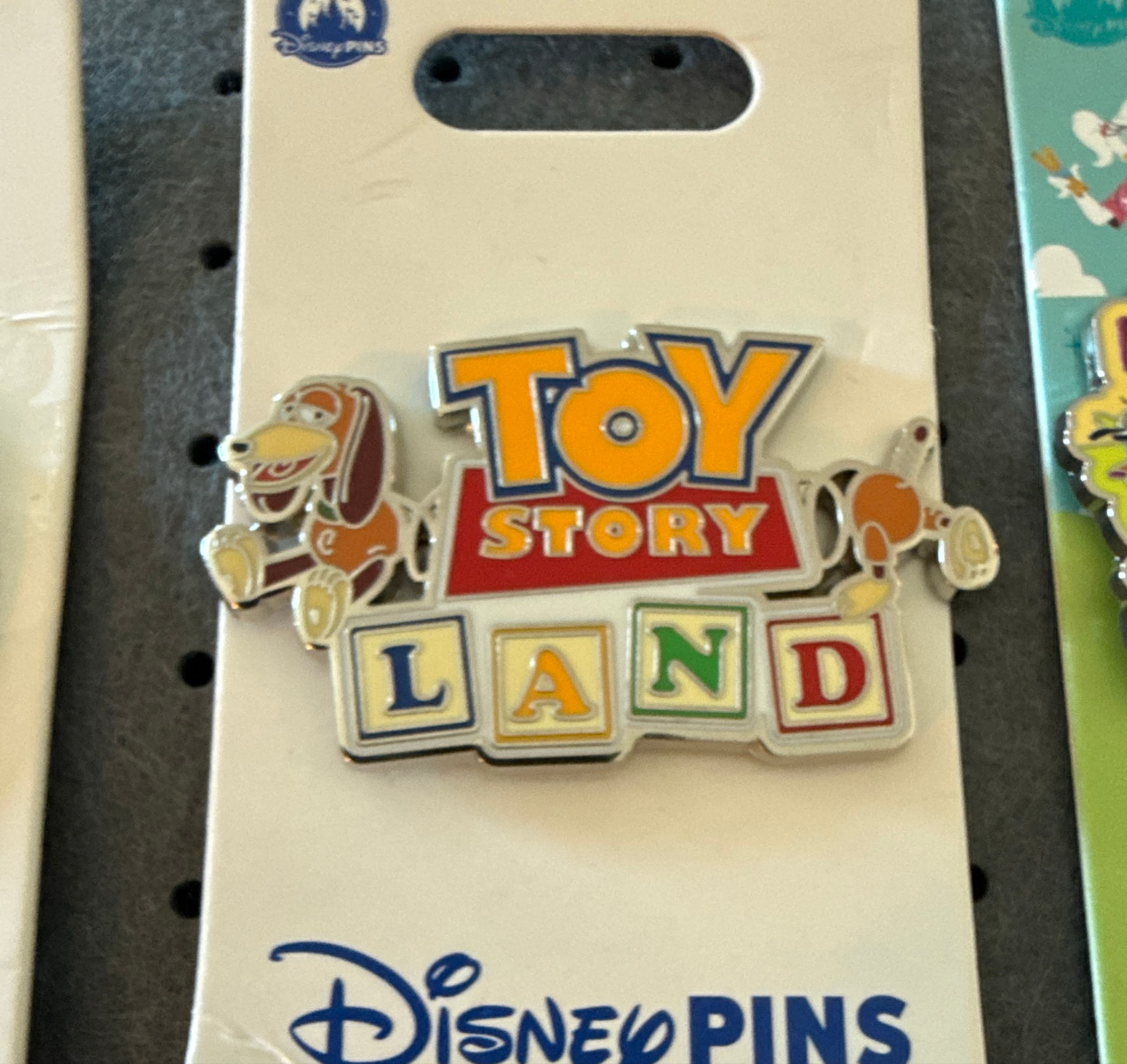 Slinky Dog Toy Story Land Logo Pin