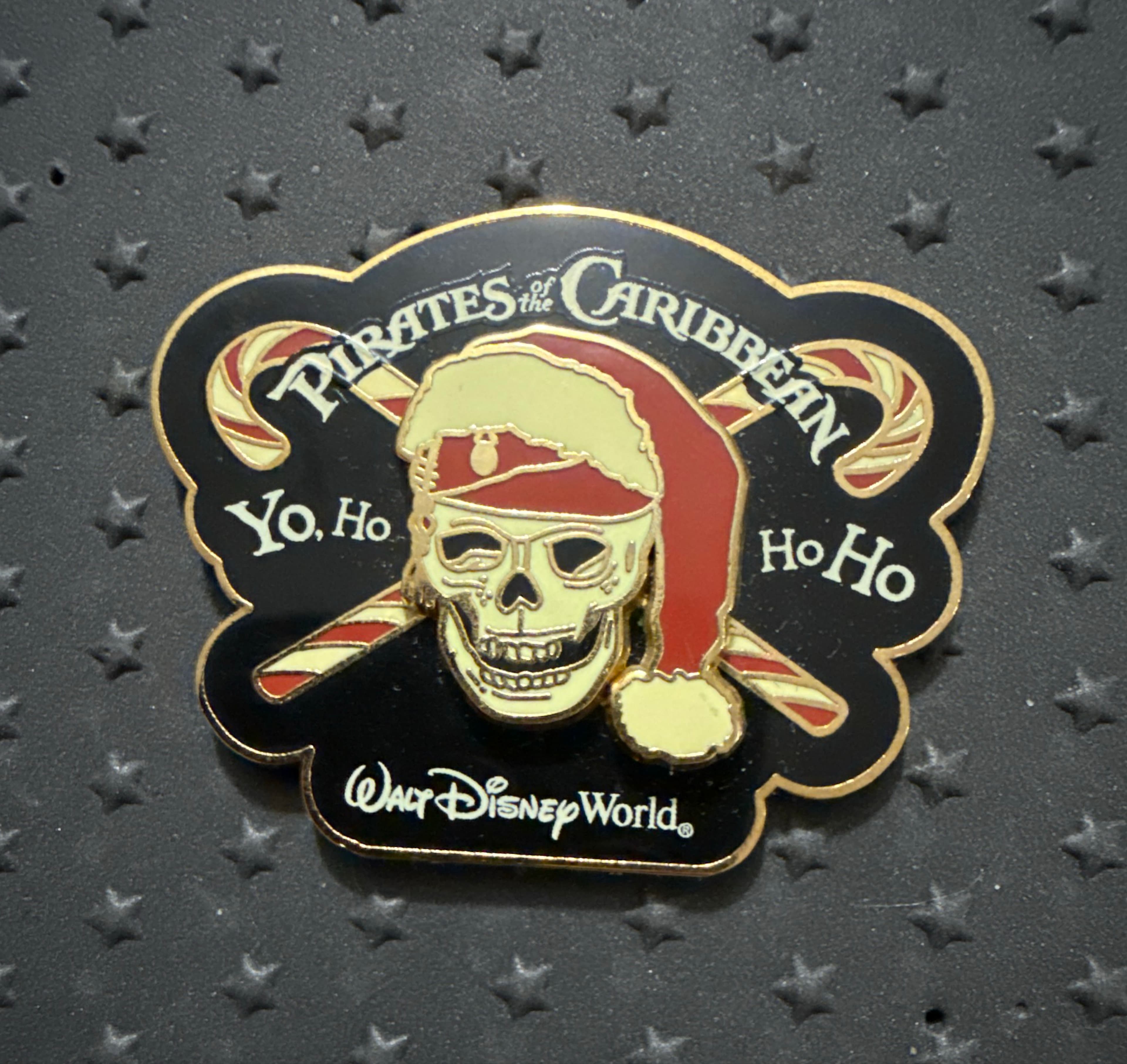 Pirates of the Caribbean Christmas Yo, Ho Ho Ho Skull with Santa Hat and Candy Canes Walt Disney World Pin