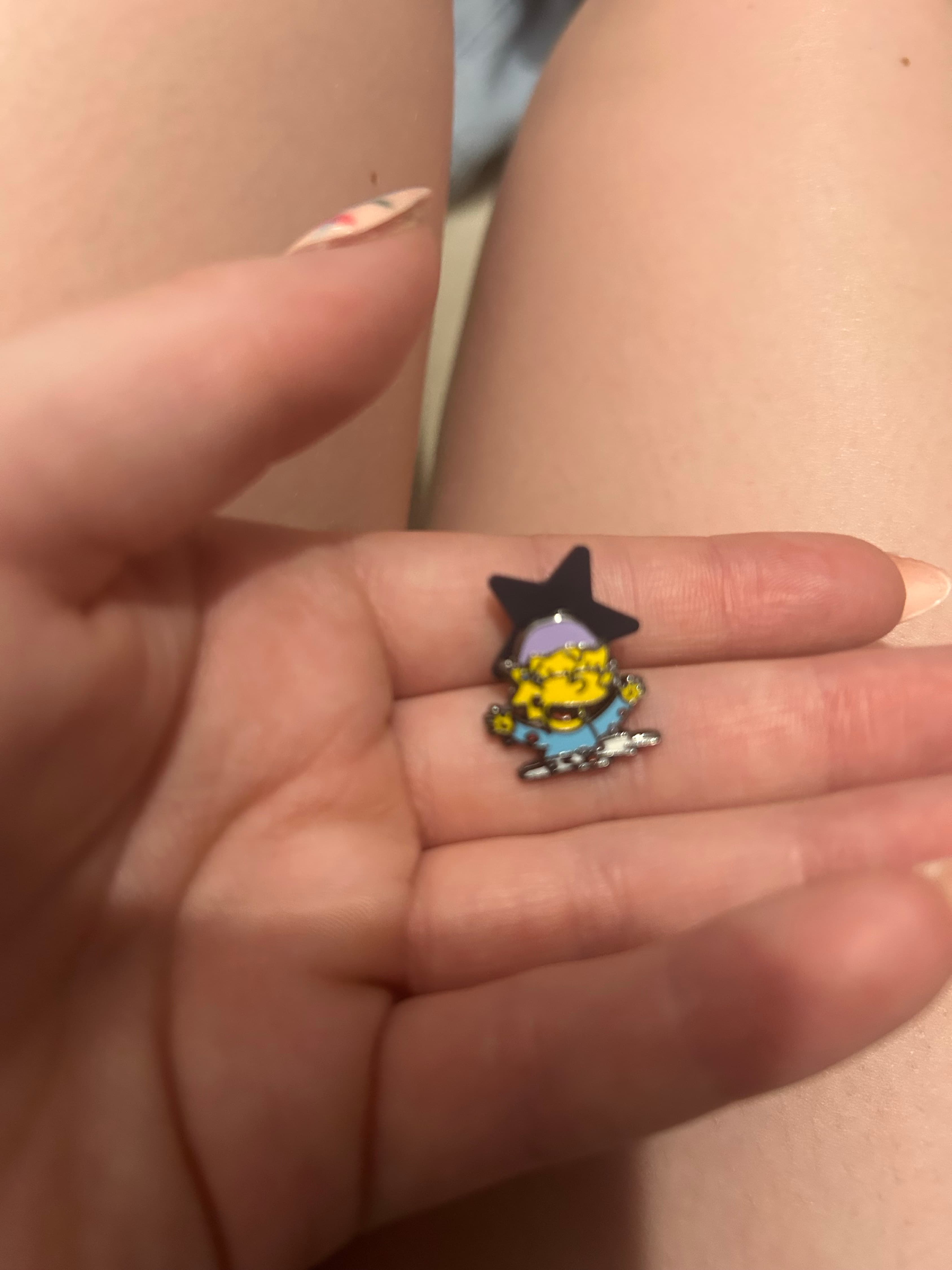 Maggie Simpson eating Krusty-O’s front