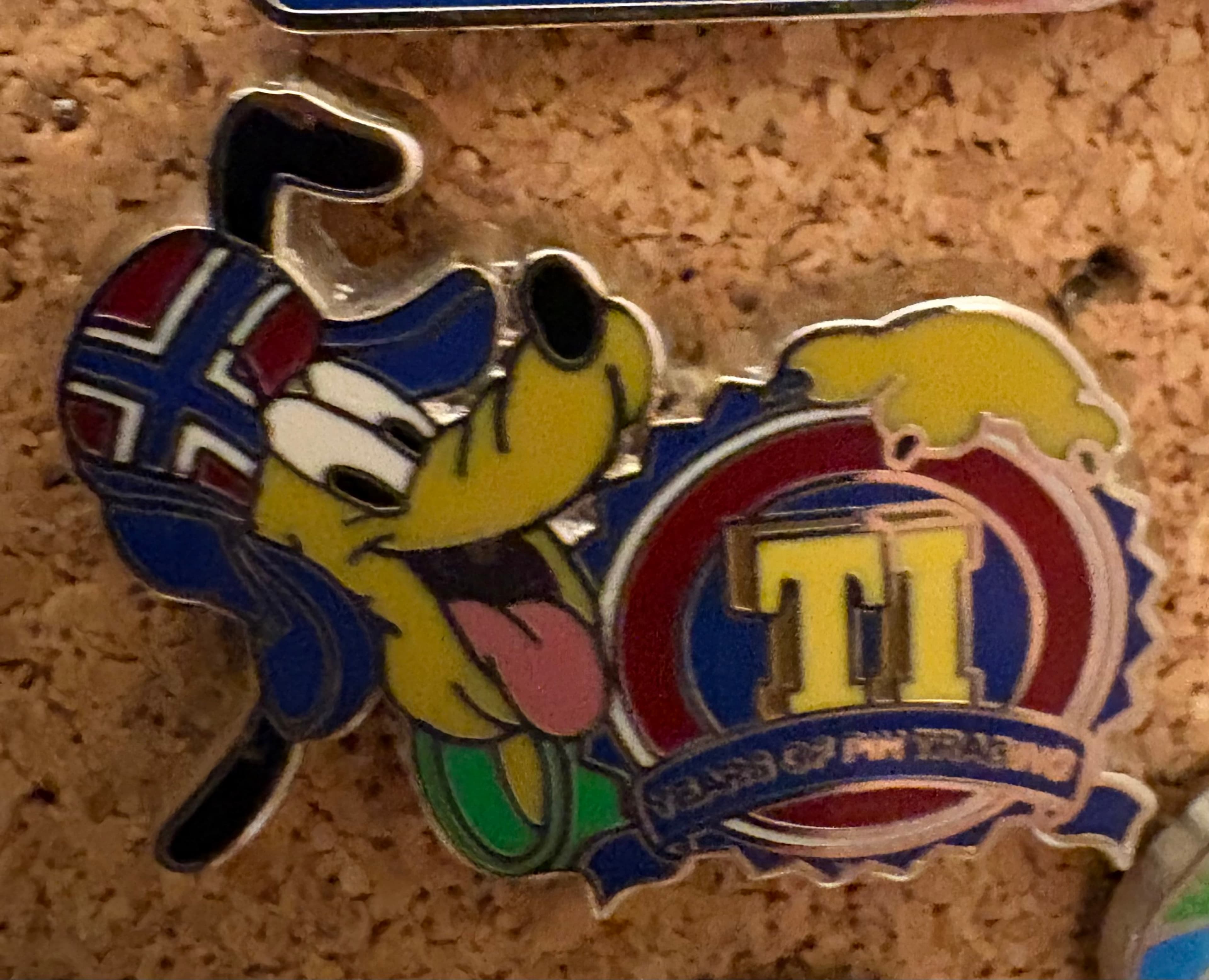 Pluto - TI (Ten in Norwegian) - 10 Years of Pin Trading front