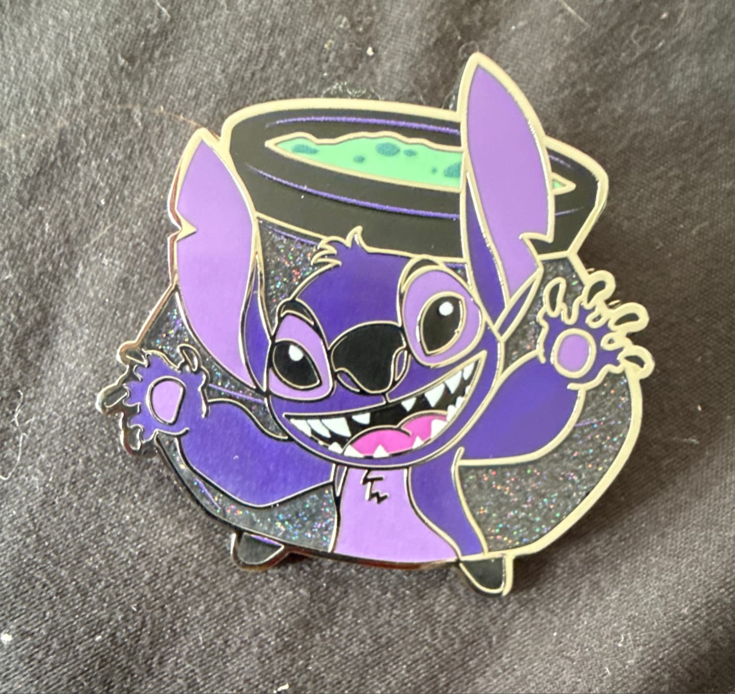 Stitch in front of a bubbling cauldron