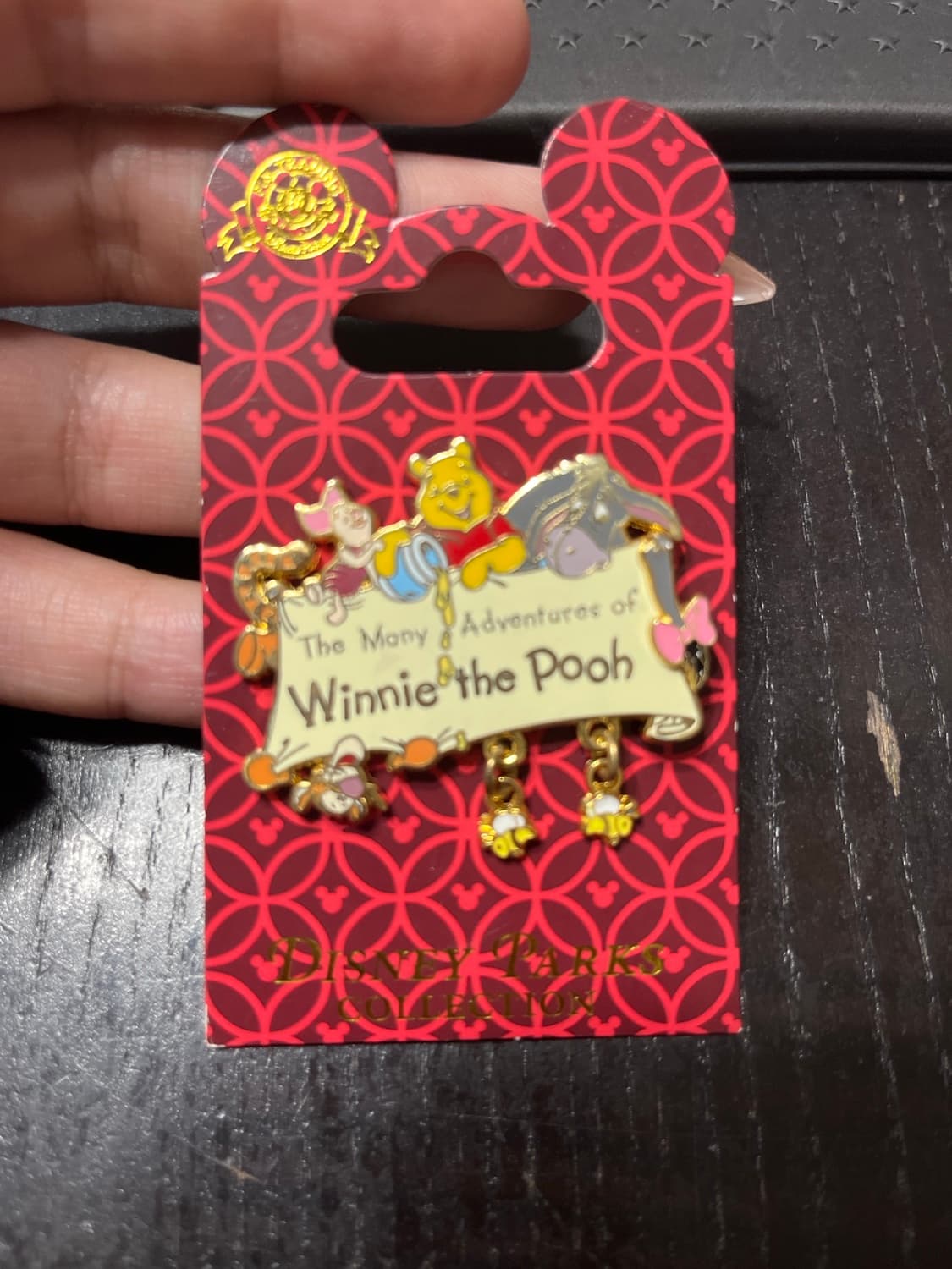 The Many Adventures of Winnie the Pooh Dangle Logo with Bees