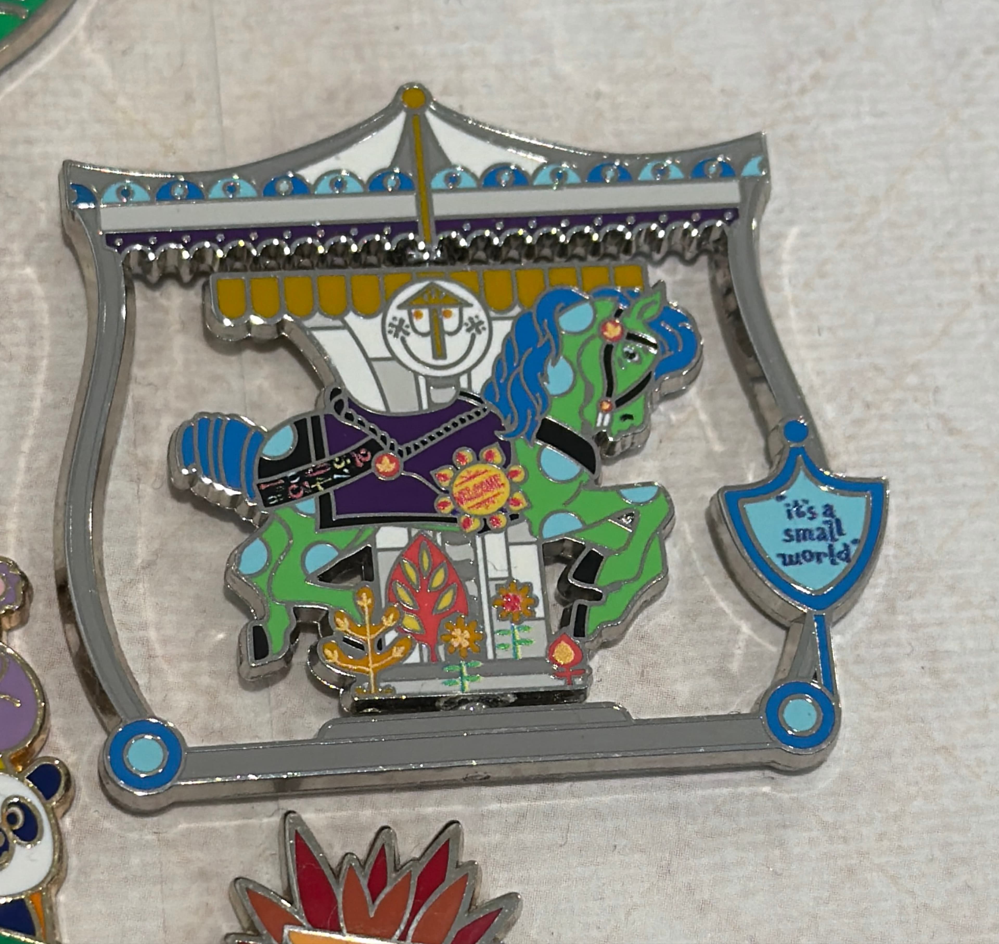 It's A Small World Charming Carousels Series Pin front