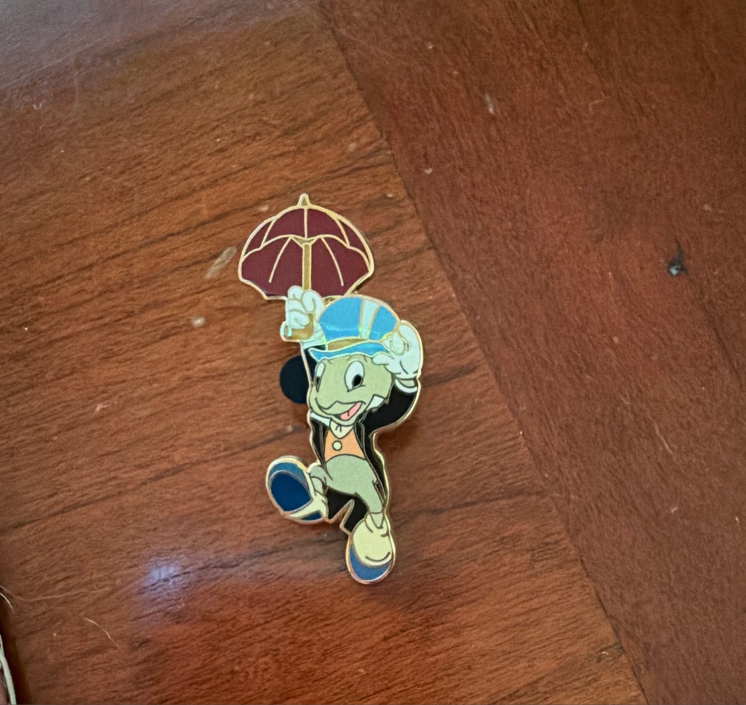 Jiminy Cricket with Red Umbrella Holding Hat