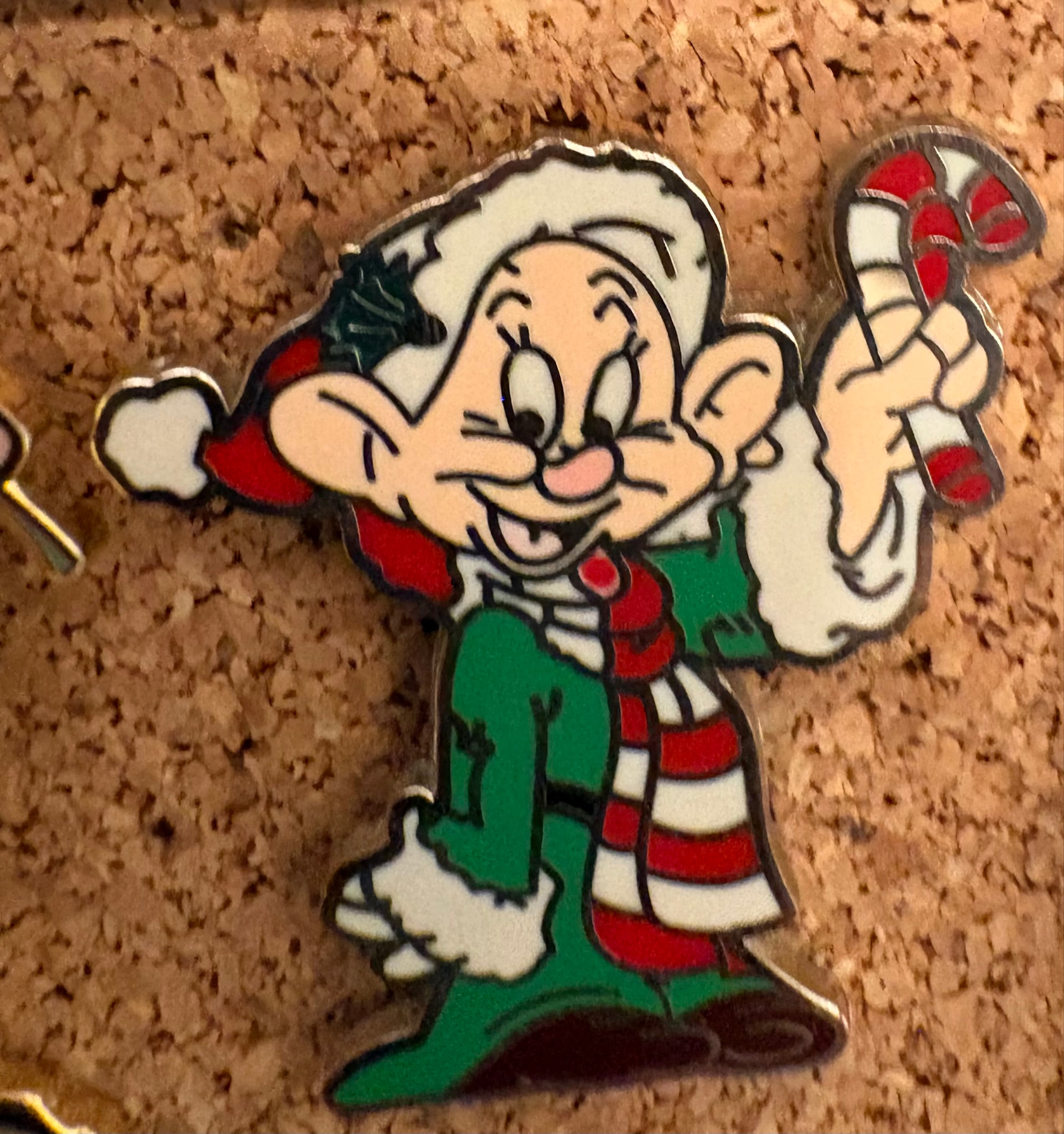 Dopey holding a Candy Cane
