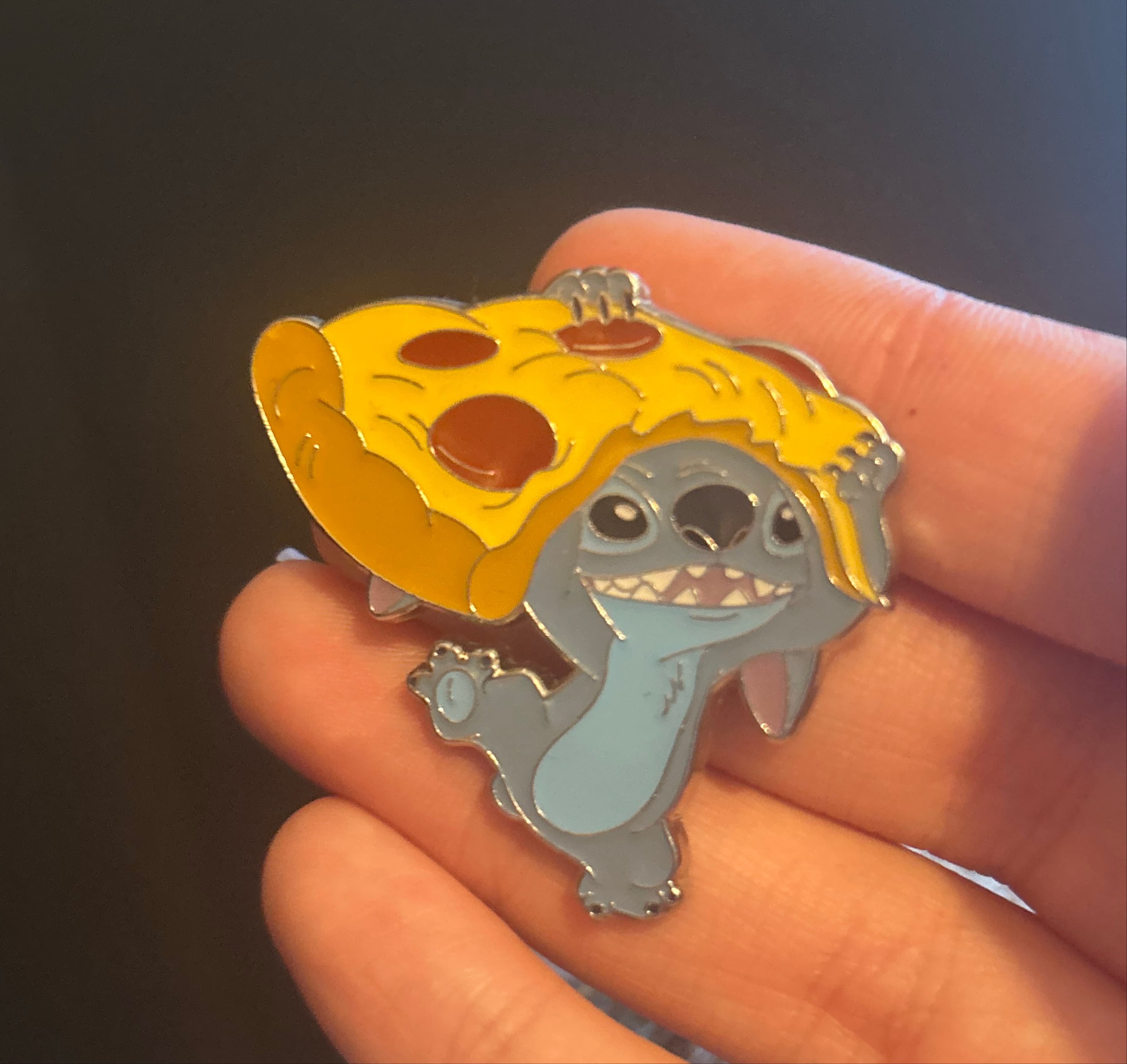 Stitch holding pizza