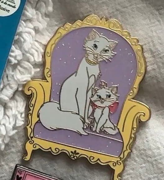 Duchess and Marie Sitting on Glitter Chair front
