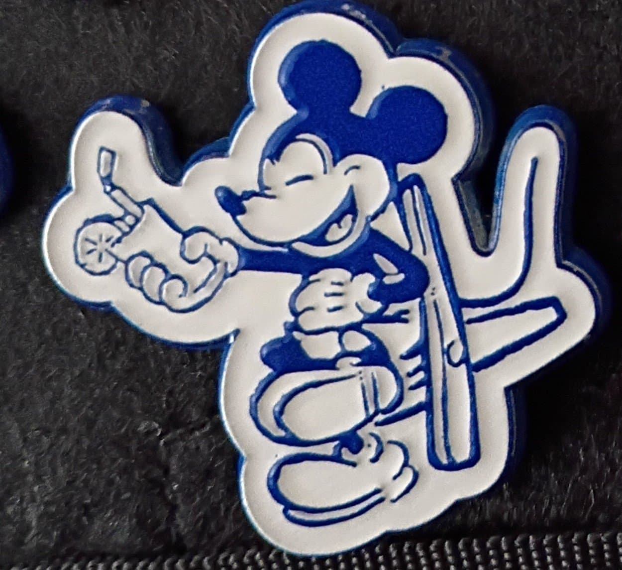 Mickey Mouse relaxing in a lounge chair