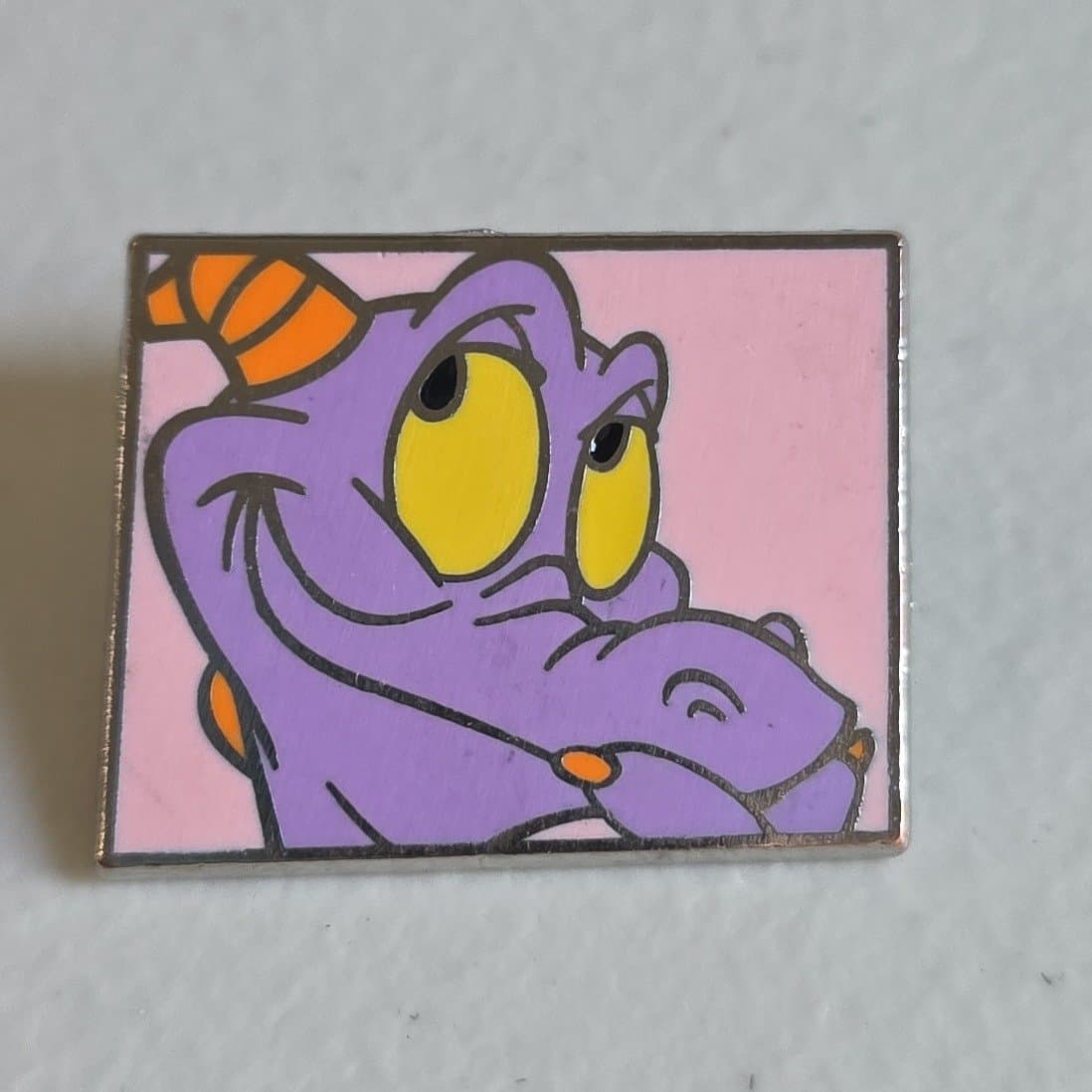 Figment smiling pink background
