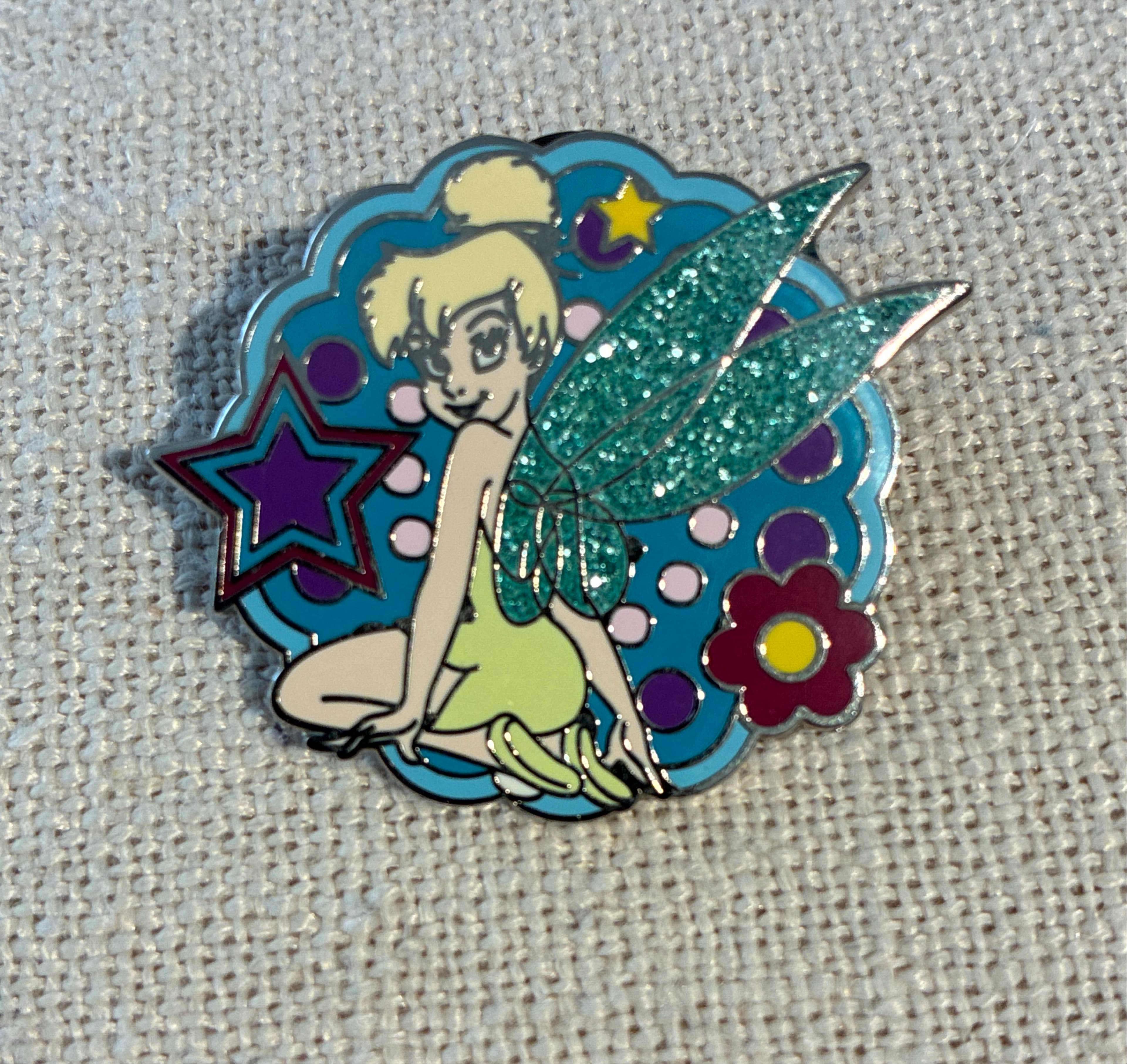 Tinker Bell Sitting with Glitter Wings, Stars, and Flower