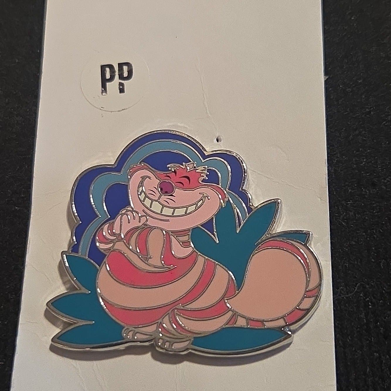 Cheshire Cat Reclining with Blue and Teal Background