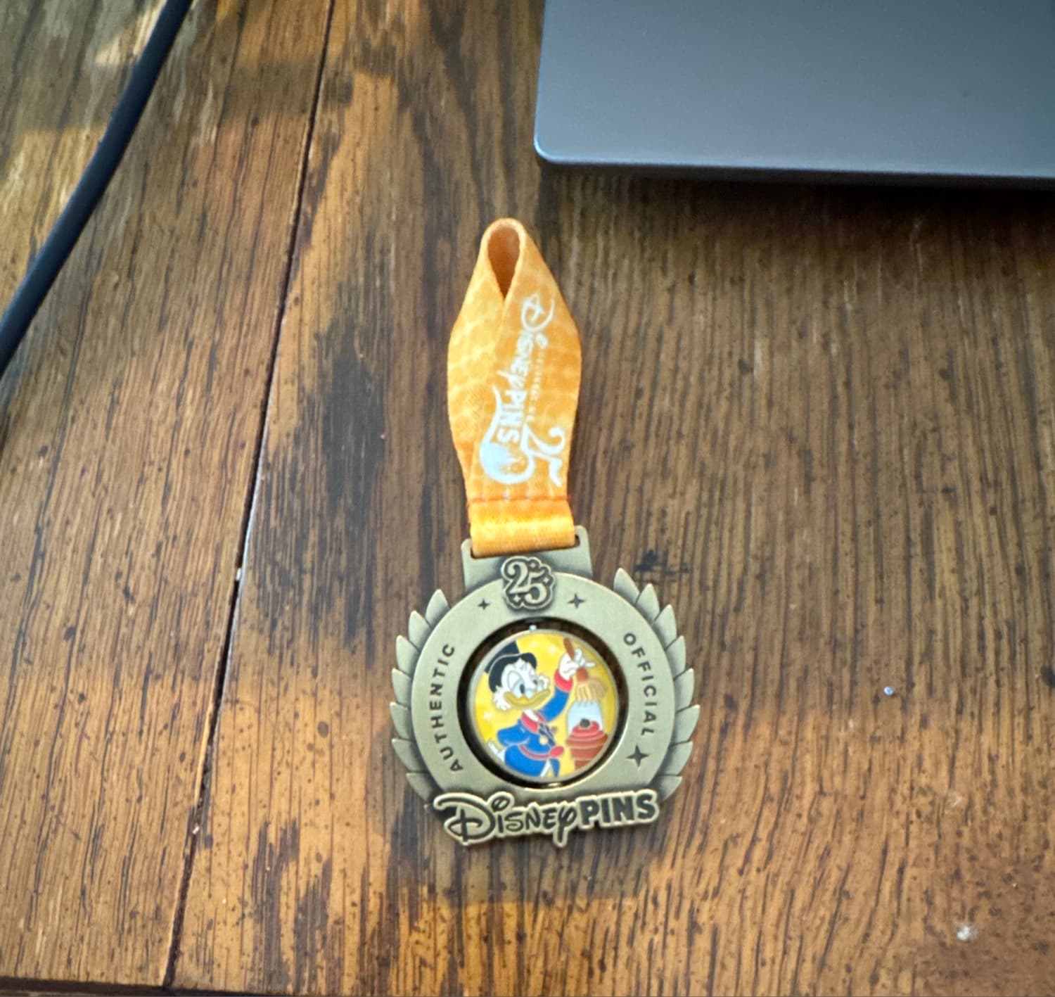 Scrooge McDuck Disney Pin Trading 25th Anniversary Medal Spinner Pin front