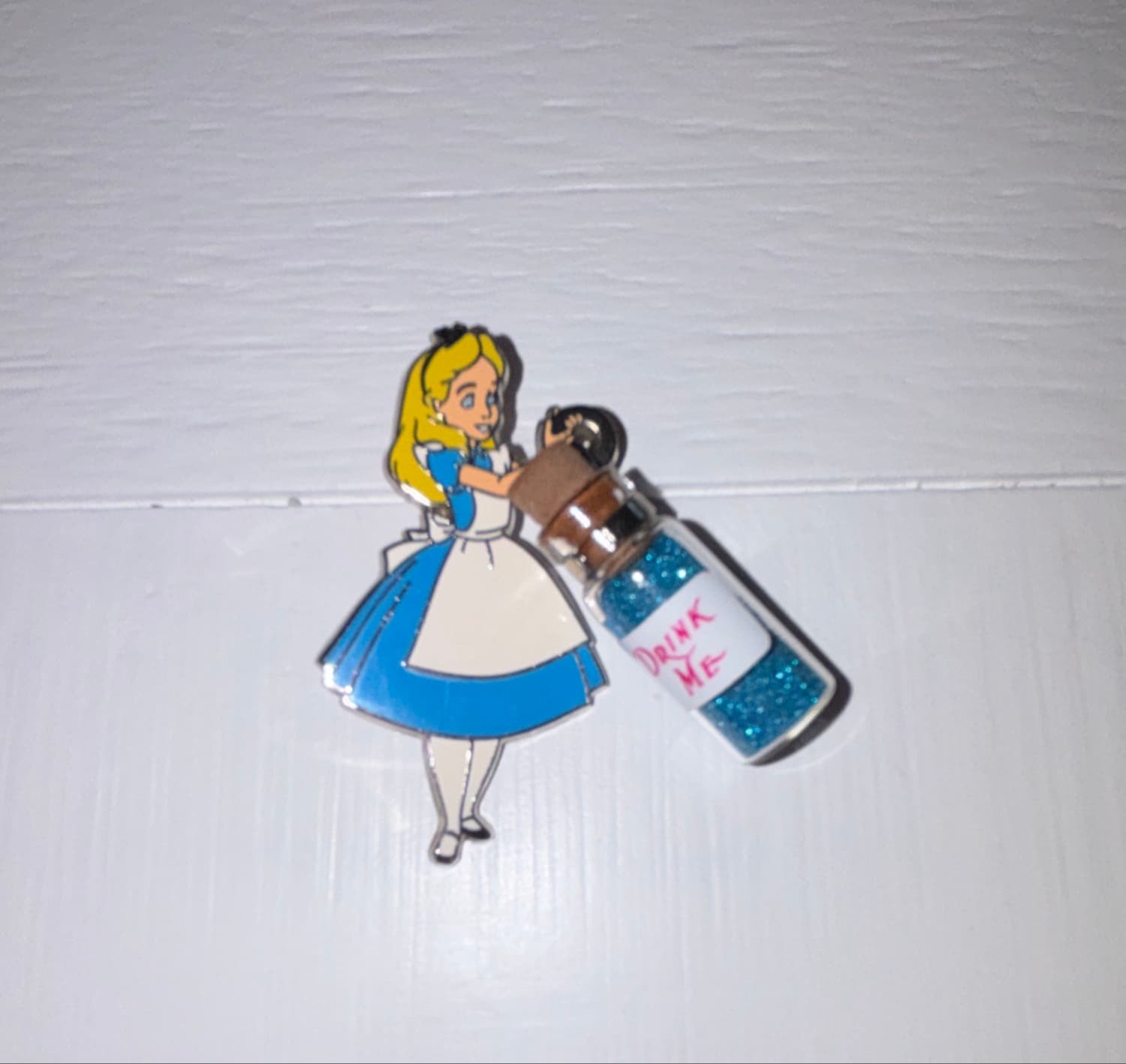 Alice with Drink Me Bottle front