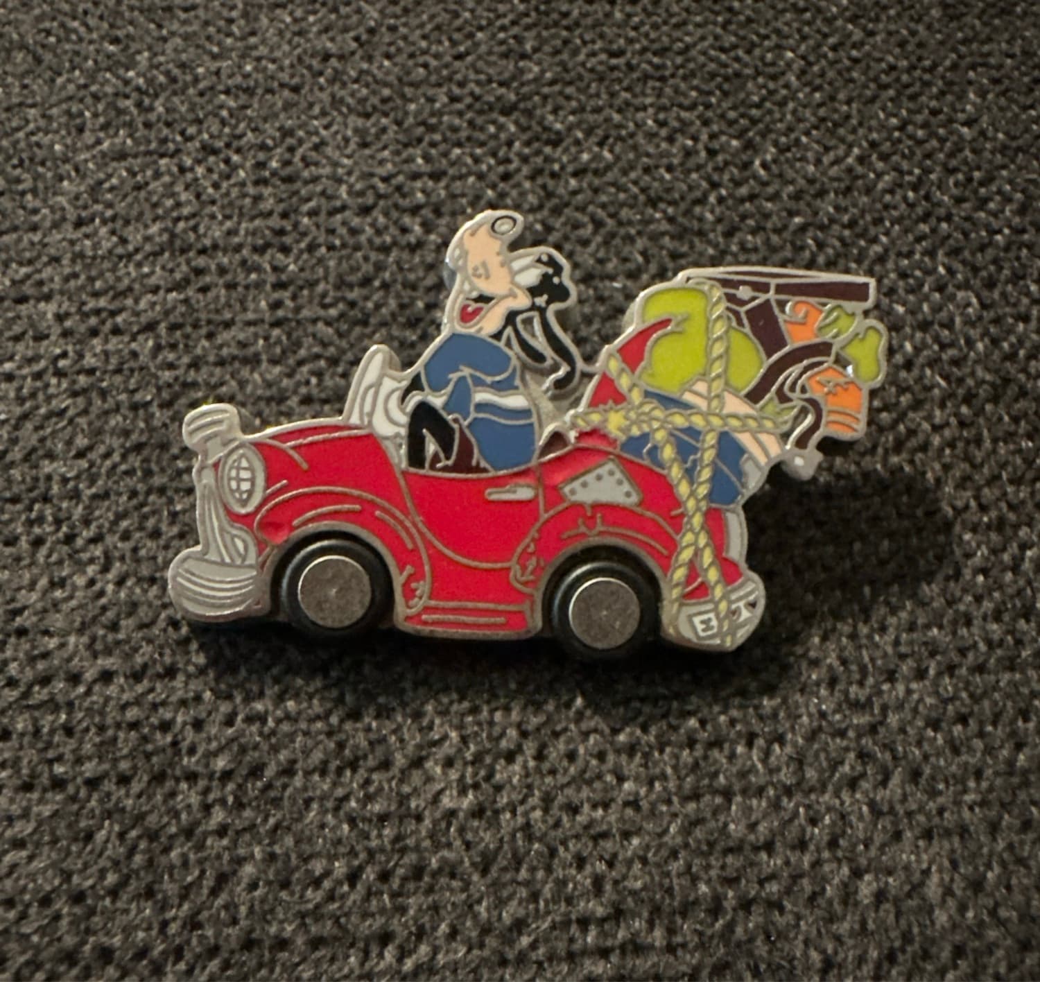 Goofy in a Beat Up Red Car